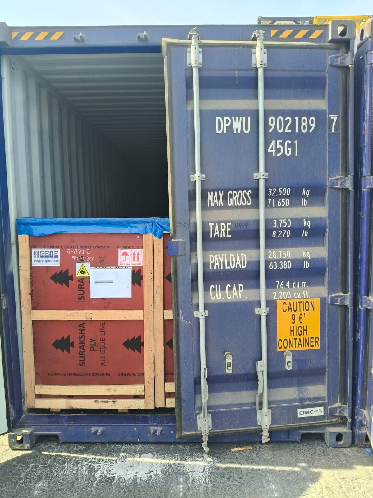 Open container door during stuffing of packed cargo